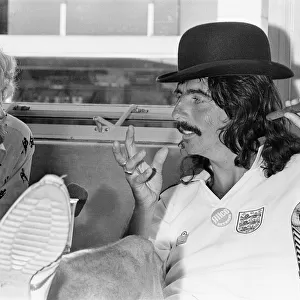 American rock singer Alice Cooper wearing a bowler hat and England football shirt