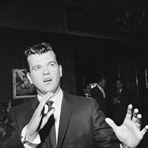 American singer Conway Twitty pictured upon his arrival in London. 6th May 1959