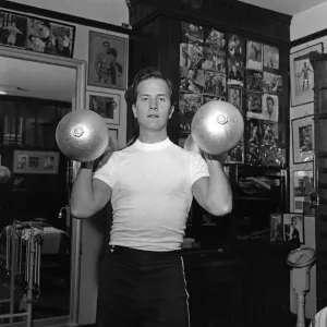 American singer, Pat Boone, exercises for his part in his next film American singer, Pat Boone, exercises for his part in his next film
