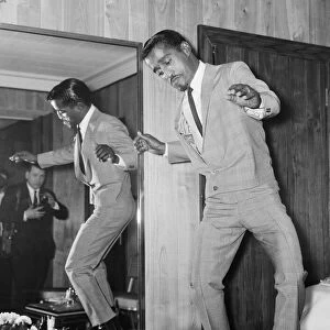 American singer Sammy Davis Junior performs a dance on a cocktail table at the Mayfair