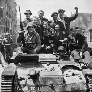 Print of American soldiers riding a captured German tank through Cherbourg Print of American soldiers riding a captured German tank through Cherbourg