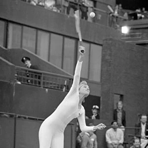 American tennis player Anne White in action wearing her white skin tight catsuit during