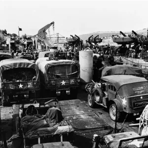 American vehicles loaded aboard landing ships in the river Dart during preparations for American vehicles loaded aboard landing ships in the river Dart during preparations for