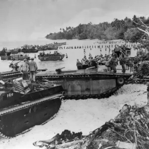 US amphibious tanks line a beach bringing in supplies to American marines who landed US amphibious tanks line a beach bringing in supplies to American marines who landed