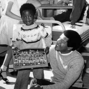 Andrew Hyman, aged 4, meets footballer Howard Gayle during a visit to the Children Andrew Hyman, aged 4, meets footballer Howard Gayle during a visit to the Children