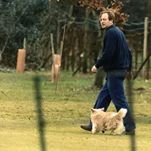 Andrew Parker Bowles husband of Camilla Parker Bowles is seen out walking their pet dog