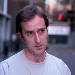 ANGUS DEAYTON WEARING T-SHIRT AND JEANS OUTSIDE SAVING HIS SOHO OFFICE IN LONDON ANGUS DEAYTON WEARING T-SHIRT AND JEANS OUTSIDE SAVING HIS SOHO OFFICE IN LONDON