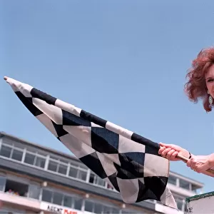 ANITA DOBSON WITH THE CHEQUERED FLAG AT THE MOTOR RACING 26 / 05 / 1992