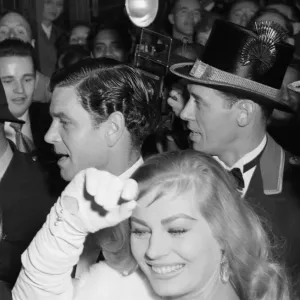 Anita Ekberg and Anthony Steele caught in the surging crowds outside the Empire Theatre Anita Ekberg and Anthony Steele caught in the surging crowds outside the Empire Theatre