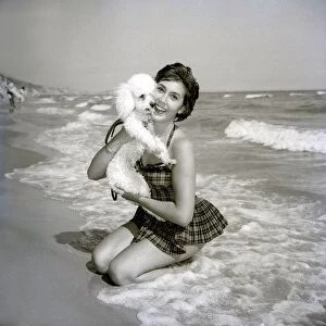 Anita Harris with poodle dog Daki on Bournemouth beach Animals Dogs