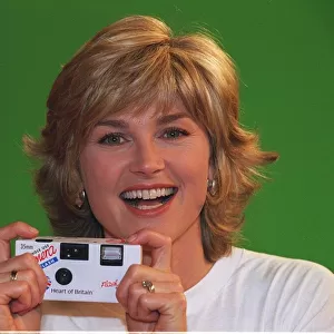 Anthea Turner takes a photograph to help the Daily Mirror Hearts of Britain Campaign