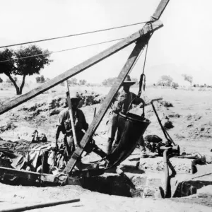 ANZAC Engineers using special leather bucket for raising water from deep wells ANZAC Engineers using special leather bucket for raising water from deep wells