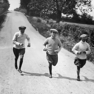Apprentice jockeys jogging down a country lane during training to reduce their weight for Apprentice jockeys jogging down a country lane during training to reduce their weight for