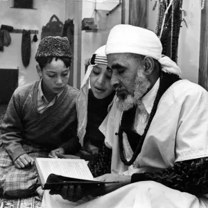 Two arab boys born in Cardiff receive instruction on the Koran Two arab boys born in Cardiff receive instruction on the Koran