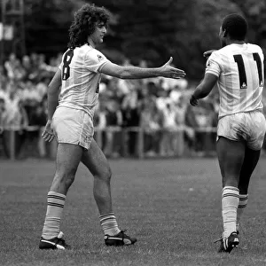 Argentina football star Mario Kempes shakes hands with Garth Crooks in a friendly game