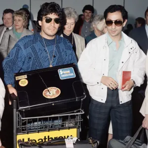 Argentina footballers Diego Maradona is met by his friend Argentina footballers Diego Maradona is met by his friend