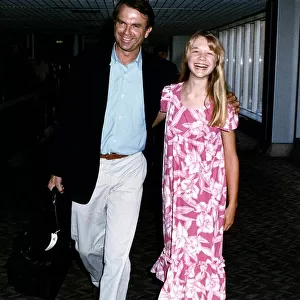 Ariana Richards American Actress and Sam Neill Actor arrive at London Heathrow Airport