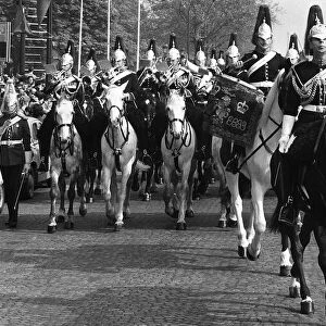 Army Household Cavalry march through the streets of Paris France on their way to lay a