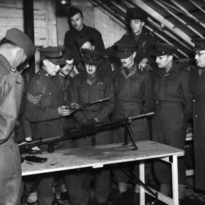 Army officers are given a demonstration on how to strip down a Bren Gun Army officers are given a demonstration on how to strip down a Bren Gun