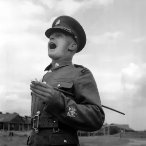 Army: Soldiers: Communication Sergeant Major Harold Kennard seen here shorting commands Army: Soldiers: Communication Sergeant Major Harold Kennard seen here shorting commands