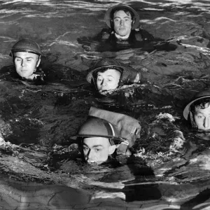 Army Traning: Swimming in full back. March 1941 P014906 Army Traning: Swimming in full back. March 1941 P014906
