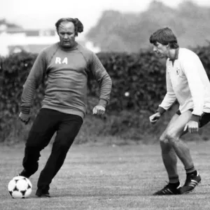 Arnold Muhren keeps a close eye on Manchester United manager Ron Atkinson during a Arnold Muhren keeps a close eye on Manchester United manager Ron Atkinson during a