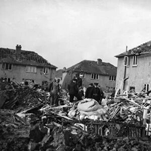 ARP personnel, Air Raid Wardens and Firemen search the devastation of Rowlston