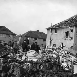 ARP personnel, Air Raid Wardens and Firemen search the devastation of Rowlston