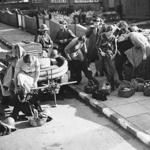 ARP women prepare for an an exercise with fire fighting equipment during WW2 1942