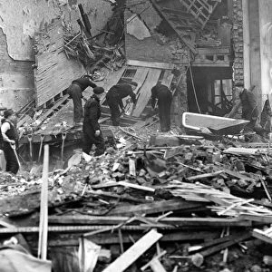 ARP workers searching the debris of one of the bombed houses in London for a victim