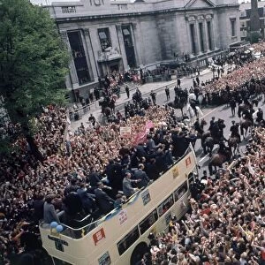 The Arsenal football team bus returns to a rapturous reception by thousands of fans