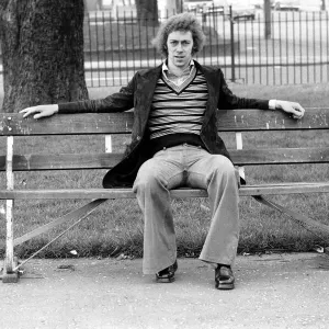 Arsenal footballer Charlie George sitting on a bench at Hackney marshes February Arsenal footballer Charlie George sitting on a bench at Hackney marshes February