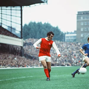 Arsenal footballer Ray Kennedy in action against Leicester City watched by David Nish