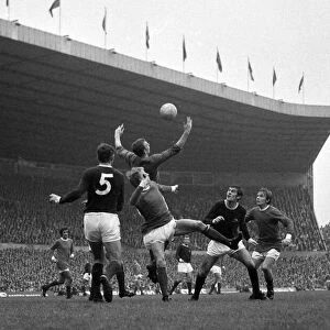 Arsenal goalkeeper Bob Wilson comes out to claim a high cross from John Fitzpatrick