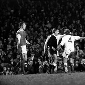 Arsenal vs. Leeds. Leeds players including Peter Lorimer argue with the referee after a