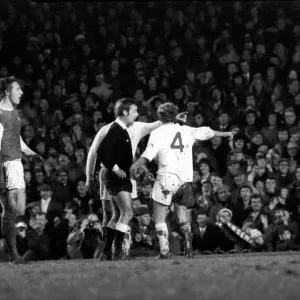 Arsenal vs. Leeds. Leeds players including Peter Lorimer argue with the referee after a Arsenal vs. Leeds. Leeds players including Peter Lorimer argue with the referee after a