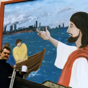 Art student Gary McNamara with the mural he has painted above the entrance to St Pius Art student Gary McNamara with the mural he has painted above the entrance to St Pius