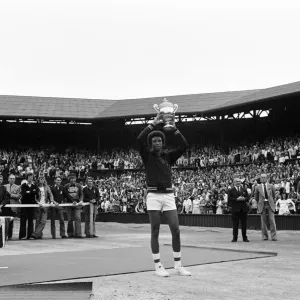 Arthur Ashe with the Wimbledon trophy after he beat the defending champion Jimmy Connors Arthur Ashe with the Wimbledon trophy after he beat the defending champion Jimmy Connors