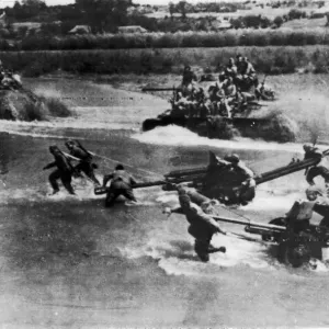 Artillery and tanks of the Russian Red Army force a river crossing in the Soviet advance
