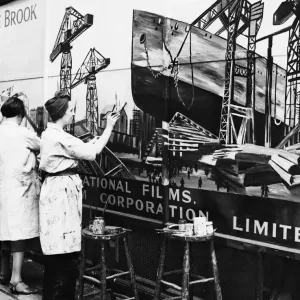 Artists painting a sign in Wardour Street during the Second World War Artists painting a sign in Wardour Street during the Second World War
