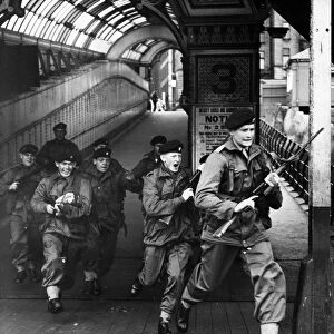 Assault troops of the Cheshire Regiment dash on to the Liverpool Landing Stage to take