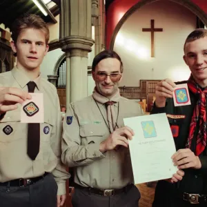 Assistant County Commissioner David Clark (centre) congratulates scouts Paul Barker (l Assistant County Commissioner David Clark (centre) congratulates scouts Paul Barker (l