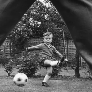 Aston Villa footballer Ron Wylie playing football with his son Nigel in the garden of Aston Villa footballer Ron Wylie playing football with his son Nigel in the garden of