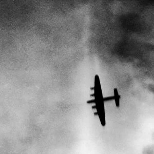 One of the attacking four engined Avro Lancaster bombers over the target area during