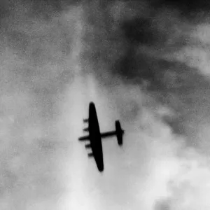 One of the attacking four engined Avro Lancaster bombers over the target area during