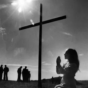 Audrea Thompson prays by the cross mounted on Tunstall Hill, Sunderland, Tyne and Wear Audrea Thompson prays by the cross mounted on Tunstall Hill, Sunderland, Tyne and Wear