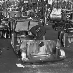 Austin Mini body panels are assembled prior to welding and being placed on the production Austin Mini body panels are assembled prior to welding and being placed on the production