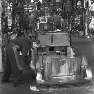 Austin Mini body panels are assembled prior to welding and being placed on the production Austin Mini body panels are assembled prior to welding and being placed on the production