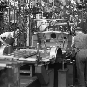 The Austin Mini production line at Longbridge. 10th March 1963 Body panels being spot The Austin Mini production line at Longbridge. 10th March 1963 Body panels being spot