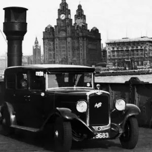 An Austin motor car crossing the River Mersey on a luggage boat in Liverpool An Austin motor car crossing the River Mersey on a luggage boat in Liverpool